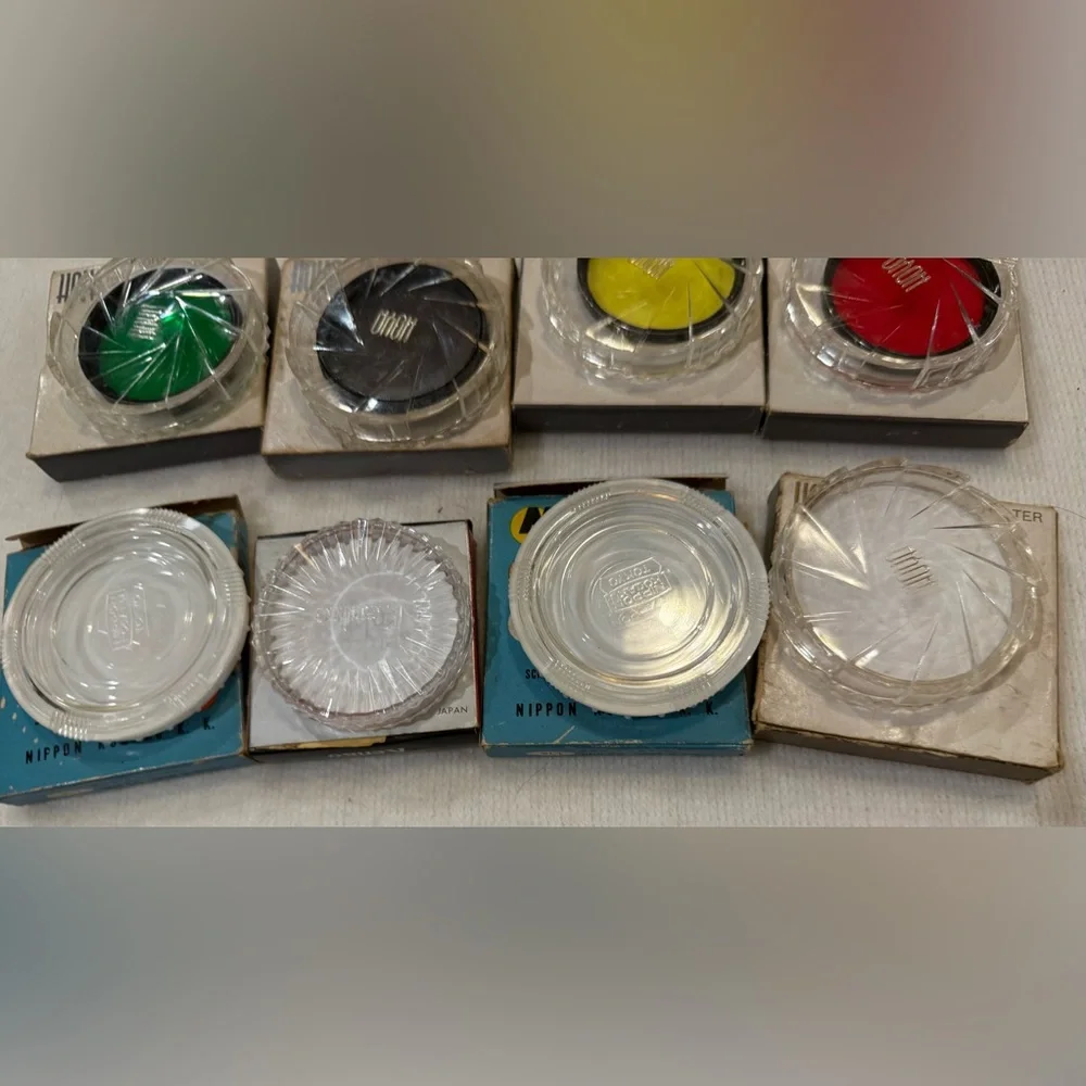 Lot of 4 Hoya photographic filters and 4 filter cases.
